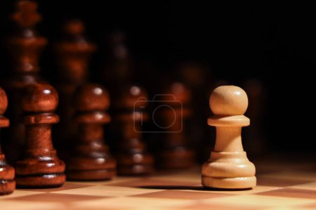 Photo for Game board with chess pieces on dark background, closeup - Royalty Free Image