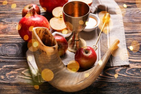 Photo for Shofar with fruits, honey and sacramental goblet for wine on wooden background. Rosh hashanah (Jewish New Year) celebration - Royalty Free Image