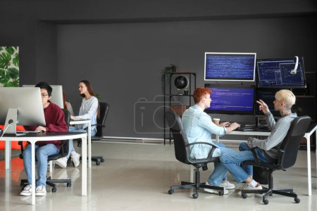Photo for Team of young programmers working in office - Royalty Free Image
