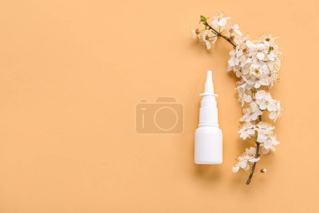 Photo for Nasal drops with blooming branch on beige background. Seasonal allergy concept - Royalty Free Image