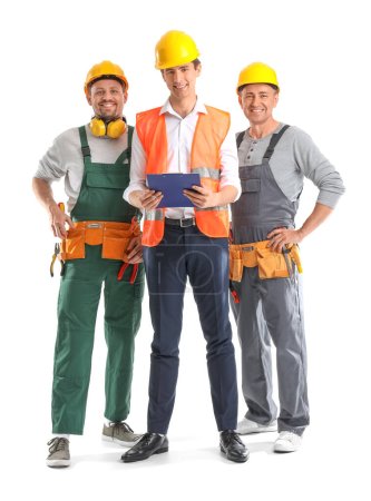Team of male builders with tools on white background