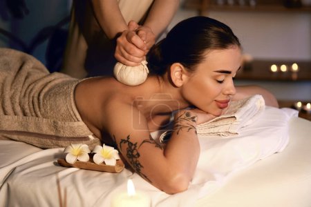 Photo for Pretty young woman having massage in spa salon - Royalty Free Image