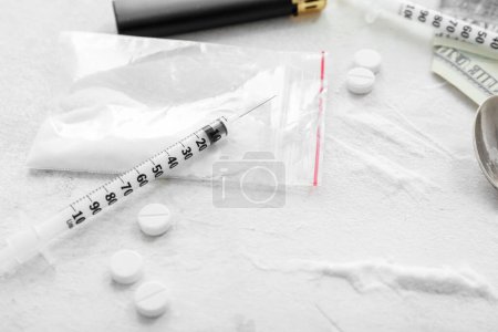 Photo for Drugs and syringe on light background - Royalty Free Image