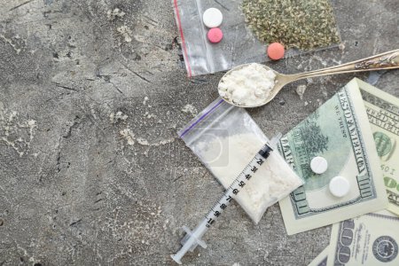 Photo for Composition with drugs, money and syringe on grunge background - Royalty Free Image