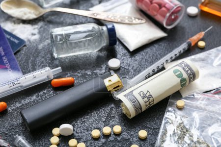 Photo for Different drugs, lighter, syringes and money on dark background, closeup - Royalty Free Image