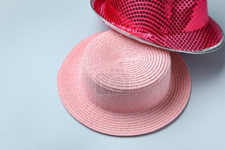 Photo for Different pink hats on blue background - Royalty Free Image