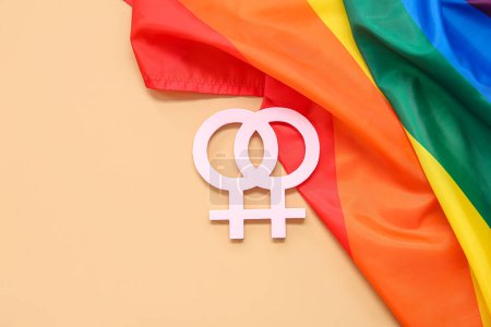 Photo for LGBT rainbow flag with female gender symbols on beige background - Royalty Free Image