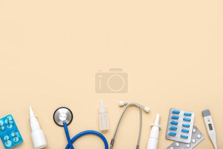 Photo for Medical supplies with nasal drops on beige background - Royalty Free Image