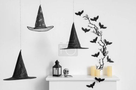 Photo for Interior of living room decorated for Halloween with fireplace and paper bats - Royalty Free Image