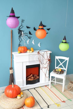 Photo for Interior of living room decorated for Halloween with fireplace and chair - Royalty Free Image