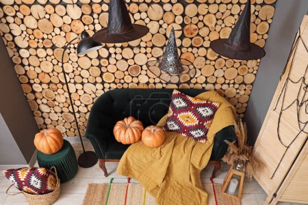 Photo for Interior of living room decorated for Halloween with sofa and pumpkins - Royalty Free Image