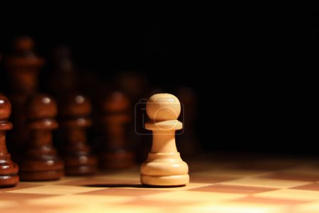 Photo for Game board with chess pieces on dark background, closeup - Royalty Free Image