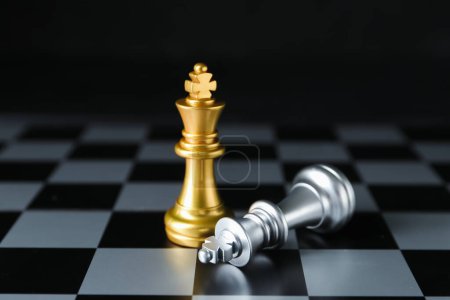 Photo for Board with chess pieces on dark background. Loser concept - Royalty Free Image