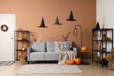 Photo for Interior of living room decorated for Halloween with sofa and shelf units - Royalty Free Image