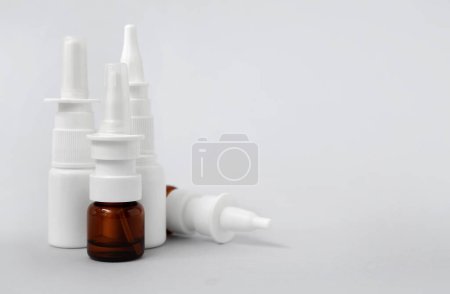 Photo for Bottles of nasal drops on grey background - Royalty Free Image