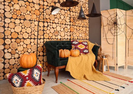 Photo for Interior of living room decorated for Halloween with sofa and pumpkins - Royalty Free Image