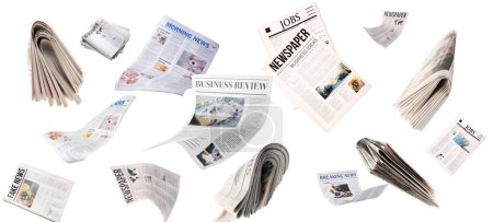 Téléchargez les photos : De nombreux journaux volants sur fond blanc - en image libre de droit