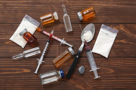 Photo for Composition with different drugs and syringes on wooden background - Royalty Free Image