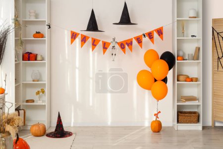 Photo for Interior of living room decorated for Halloween with shelf units - Royalty Free Image