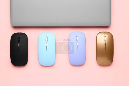 Photo for Laptop with computer mouses on pink background - Royalty Free Image