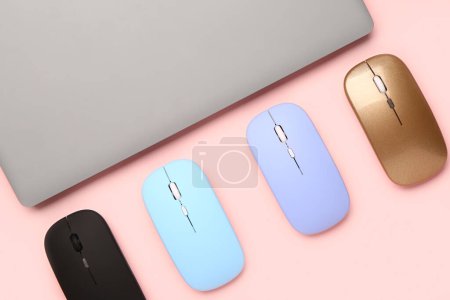 Photo for Laptop with computer mouses on pink background - Royalty Free Image