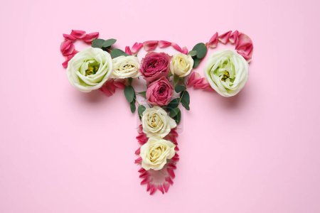 Photo for Uterus made of beautiful flowers on pink background - Royalty Free Image