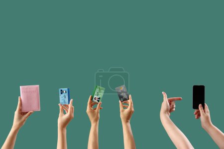 Photo for Women with passport, driving licenses, credit card and mobile phone on green background - Royalty Free Image