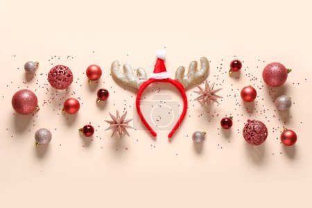 Christmas reindeer horns with decor on beige background