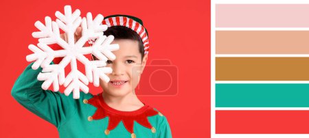 Foto de Lindo niño asiático en traje de elfo y con copo de nieve sobre fondo rojo. Diferentes patrones de color - Imagen libre de derechos