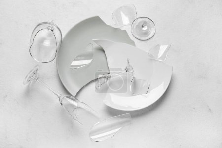 Photo for Broken dishes and glasses on light background - Royalty Free Image