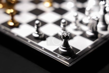 Photo for Silver chess pieces on game board, closeup - Royalty Free Image