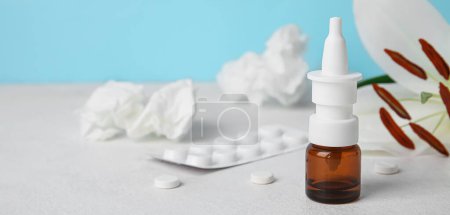 Photo for Nasal drops, pills, flower and tissues on table. Allergy concept - Royalty Free Image