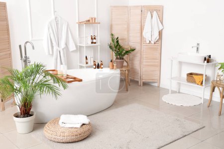 Photo for Interior of bathroom with bathtub and accessories - Royalty Free Image