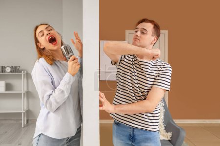 Young man suffering from loud neighbour singing at home