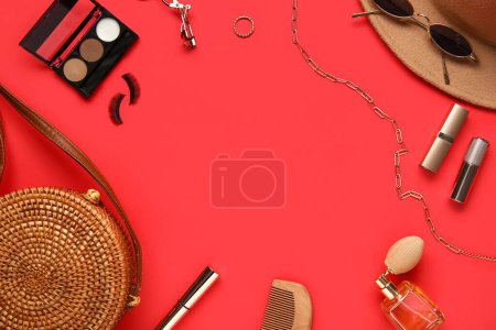 Photo for Frame made of stylish female accessories and cosmetics on red background - Royalty Free Image