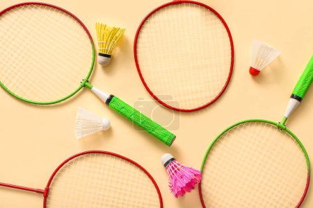 Photo for Composition with different badminton rackets and shuttlecocks on color background - Royalty Free Image
