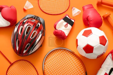 Photo for Composition with different sports equipment on orange background - Royalty Free Image