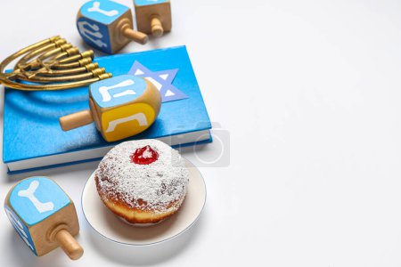 Photo for Hanukkah composition with Torah, dreidels, menorah and donut on white background - Royalty Free Image