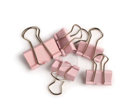 Foto de Pink binder clips on white background - Imagen libre de derechos