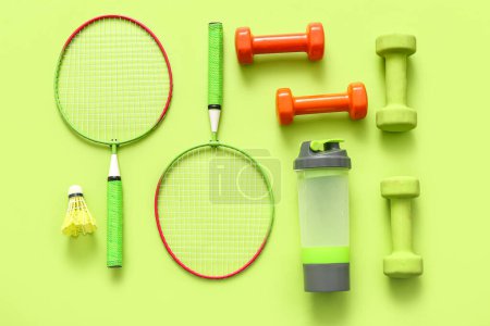 Photo for Composition with different sports equipment on green background - Royalty Free Image