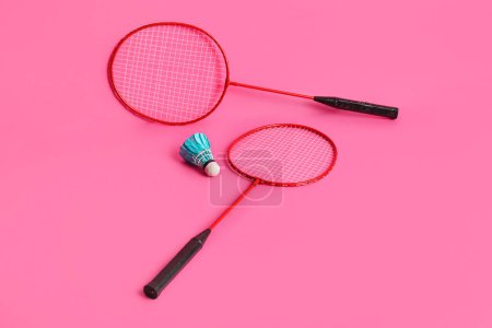 Photo for Badminton rackets and shuttlecock on pink background - Royalty Free Image