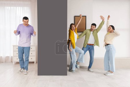 Photo for Young man suffering from loud neighbours dancing at home - Royalty Free Image