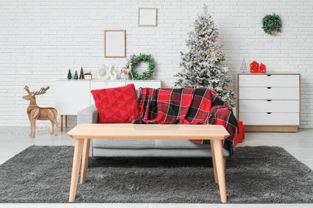 Photo for Interior of stylish living room with beautiful Christmas tree and gift boxes - Royalty Free Image