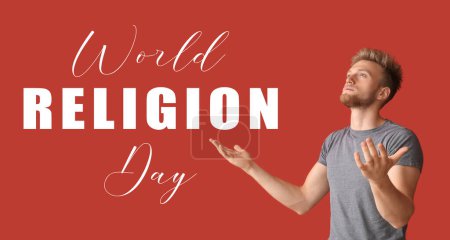 Photo for Young man praying to God on red background. Banner for World Religion Day - Royalty Free Image