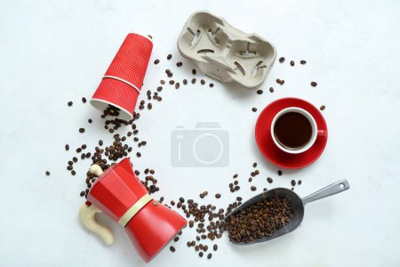 Foto de Marco hecho de tazas, taza con espresso, frijoles, cafetera géiser y soporte sobre fondo claro - Imagen libre de derechos