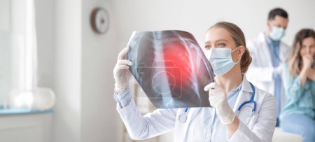 Photo for Female doctor with x-ray image of lungs in clinic. Banner for design - Royalty Free Image
