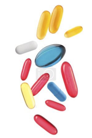 Téléchargez les photos : De nombreuses pilules volantes différentes sur fond blanc - en image libre de droit