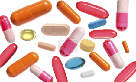 Téléchargez les photos : De nombreuses pilules volantes différentes sur fond blanc - en image libre de droit