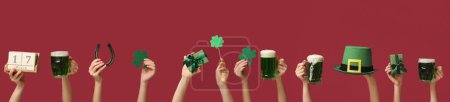 Photo for Many hands with beer, gifts and decor on red background. St. Patrick's Day celebration - Royalty Free Image