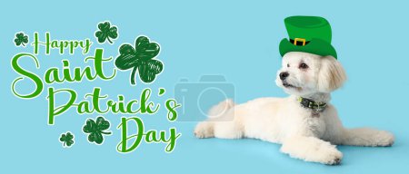 Photo for Cute fluffy dog in leprechaun's hat and text HAPPY ST. PATRICK'S DAY on light blue background - Royalty Free Image